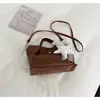 Bolso de cubo tejido de nicho transfronterizo 2026 nuevo bolso de cesta de moda para mujer bolso de mano simple para hombro cruzado