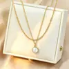 Bestseller transfronterizo: Colgante de anillo de bola de oro pequeño no descolorante de acero de titanio simple, cadena para la clavícula de lujo ligero, exquisita y versátil con eslabones grandes