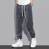 Pantalones de chándal de nuevo estilo Otoño e Invierno para Hombre Pierna Suelta Rayados Pantalones Deportivos de Pana para Hombre Pantalones Casuales Marca de Moda