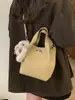 Bolso Cubo Portátil de Nicho Estilo Coreano para Mujer Primavera 2026 Nuevo Retro de Alta Calidad Casual Bandolera