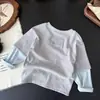Camiseta de manga larga de dos piezas falsas, novedad de otoño 2026 para niños y niñas, top versátil para niños, estilo moderno