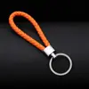 Llavero colgante de cuerda de cuero tejido de fábrica con cabeza de plástico para pareja, llavero de coche de cuero, colgante, accesorios, venta al por mayor
