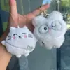 Libro Rojo Pequeño Suave y Lindo Mismo Estilo Lindo Alto Valor Chirriante Colgante de Peluche Conejo Llavero Trébol de la Suerte Gato