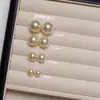 Pendientes de botón de perla S999 plateados por todas partes para mujer, sencillos y elegantes, pendientes de lujo ligero de alta gama, nuevo modelo popular 2026