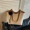 Bolsa de ombro para estudantes transfronteiriça, nova coleção outono 2026, bolsa tote moderna e de grande capacidade, bolsa de mão retrô para o dia a dia