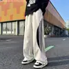 Pantalones de chándal con cordón a rayas de bloques de color de verano de marca de moda otoñal para hombre, estilo callejero vintage, pantalones casuales holgados y versátiles