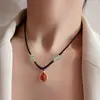 Tide nacional ágata roja frijol de acacia cuerda negra collar cadena de suéter cadena de clavícula Nueva moda china collar Joker para mujer Venta al por mayor
