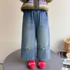 Calça Jeans Feminina Estilo Coreano com Botões Estilo Primavera/Outono 2026 Nova Moda Infantil Calça Longa Estilosa para Bebês e Crianças Pequenas