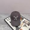 Gorra de béisbol suave con visera bordada con lazo rosa de diseñador coreano Ins Niche para mujer, bonita y dulce.