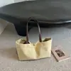 Bolsa tote simples de lona para mulheres, bolsa de ombro grande para o dia a dia, nova coleção outono 2026, cor sólida, estilo descontraído, bolsa de mão