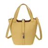 Bolso de Mano Pequeño Texturizado Transfronterizo para Mujer 2026 Nuevo Vintage Versátil Elegante Bolso Cubo para Viaje Diario Bolso de Hombro Único Bolso Cruzado