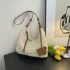 Bolsa de palha tecida nicho estilo coreano para mulheres, nova tendência primavera 2026, bolsa versátil vazada para praia e ombro/transversal