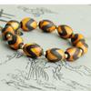 Xizang envolvido Polpa pulseira masculina Tianzhu à primeira vista para bênção familiar Nove Olhos pulseira Tianzhu preto e branco Duobao Tianzhu