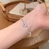 Pulsera de Perlas Elegante con Lazo de Circonita Brillante Plateado Lujo Accesible Joyería de Mano para Mujer Accesorios Exquisitos