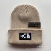 Venta al por mayor de comercio exterior marca de moda gorro de punto japonés casual gorro de lana para hombre y mujer cálido gorro de punto con letras que combina con todo gorro para el frío