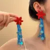 Aretes de Borla con Flor de Tela de Aguja de Plata, Modernos y Etéreos, Estilo de Vacaciones de Nicho, Venta al por Mayor de Aretes de Gama Alta