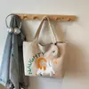 Versão Coreana da Bolsa de Lona Ins Gato Fofo de Grande Capacidade para Mulheres 2026 Novo Modelo Bolsa de Ombro Casual para Estudantes, Sala de Aula, Deslocamento