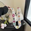 Bolso de hombro tejido a mano estilo coreano con calados florales tridimensionales, un bolso tote casual y espacioso para mujer