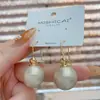 Elegantes y a la moda aretes colgantes de perla estilo coreano, con un diseño único y estiloso, perfectos para el uso diario y para complementar cualquier atuendo.