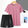 Conjunto Esportivo de Seda Gelada de Verão Secagem Rápida Respirável Camiseta Gola Redonda Conjunto Curto Tendência Feminina Conjunto de Duas Peças para Corrida e Montanhismo Absorvente de Suor