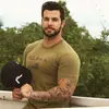 Camiseta Deportiva de Verano con Cuello Redondo para Hombre Muscle Fitness Europea y Americana Manga Corta Ropa de Entrenamiento para Fitness Running Manga Corta alpha