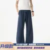 Calça esportiva de verão azul texturizada de corte relaxado, estilo old money, calça casual elástica, estilo americano Klein moderno masculino