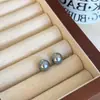 Pendientes de botón de perla gris plateado de alta calidad, lujo ligero, versátiles, simples, para perforación de oreja, diseño de nicho