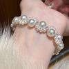 Pulsera de Garra de Gato con Perlas Estilo Moda Francés Nicho Dulce Manta Rosa Perla Shijia Elástica de Alta Gama