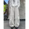 Pantalones casuales tipo patchwork deconstruido estilo americano para hombre, pantalones deportivos holgados de pierna recta para otoño con diseño moderno, pantalones de pierna ancha