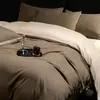 2026 Novo Estilo de Luxo Leve Cor Sólida Bicolor Amigo da Pele Algodão Lavado à Água Conjunto de Quatro Peças Capa de Edredom Lençol de Cama Conjunto de Três Peças para Dormitório Estudantil