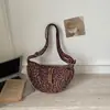 Lona fresca y elegante con estampado de leopardo 2026 nuevo modelo de verano ins de moda versión coreana bolsa tipo dumpling bolsa de axila de alto valor