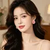 Pendientes de botón de flor de rosa de resina de color macarrón dulce estilo europeo y americano para mujer Pendientes de moda de lujo ligero Pendiente transfronterizo