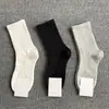 Meias de massagem masculinas meias de cano médio estilo casal anti-odor unissex todas as estações esportivas cor sólida casuais meias curtas da moda