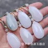 Colgante de Mariposa y Loto de Jade Verde Tianshan de Xinjiang Jade Natural para Hombres y Mujeres Estilo Chino Cadena para Suéter Colgante Venta al por Mayor