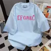 Camiseta de Manga Curta Hip-Hop com Estampa de Letras Tendência Nacional Estilo Japonês Verão Casual Design Solto Versátil Top para Casal