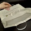Bolsos de Plástico Personalizados Boca Plana de PE Bolsa de Compras para Tienda de Ropa Bolsa de Regalo Impermeable Bolso de Mano Hecho a Medida