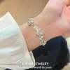 Nuevo brazalete tejido con cuentas estilo sal de nicho con un toque único de alta gama, moderno y elegante, versátil y personalizado