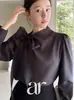 Camisa elegante e delicada estilo coreano com gola de laço diagonal, blusa pullover de cor sólida doce para primavera/outono 2026