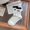 Nuevos calcetines de tubo de algodón fino para primavera y verano 2025 con bordado de cachorro lindo estilo académico para niños