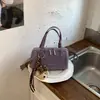 Bolso tipo almohada de nicho de lujo ligero para mujer 2026 Nuevo de moda Versátil Bolso de mano y bandolera de moda para el trabajo Casual Bolso Boston