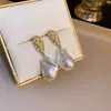 Pendientes de plata con baño de oro real, aguja cuadrada, borla de perla y circonita, pendientes de lujo ligero de alta gama, fabricante de pendientes vintage