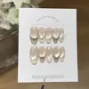 Taoshili [Diamante Triturado Blanco Lechoso] - Una colección versátil, simple y translúcida de puntas de uñas hechas a mano estilo francés, de color amarillo lechoso y con reflejos iridiscentes