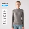 Nueva camiseta base de cuello alto versátil de corte ajustado para mujer, otoño e invierno 2026, top de manga larga de color liso ajustado