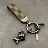 Viagem segura fulvo chaveiro pingente requintado telefone móvel pingente criativo masculino e feminino casal chaveiro do carro