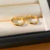 Pendientes de aro redondos chapados en oro real de 18k con incrustaciones de circonita, simples y elegantes, versátiles para el uso diario, lujo ligero con un toque de alta gama