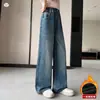 Pantalones de invierno para niñas 2026 estilo coreano versátiles de mezclilla bordados forrados de polar hasta el suelo para niños medianos y grandes otoño pierna recta pierna ancha al por mayor