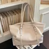 Moda Minimalista Transfronteiriça 2026 Nova Coleção Primavera/Verão Feminina Design de Nicho Exquisite de Alta Qualidade Bolsa Tote de Ombro Único