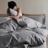 Juego de cuatro piezas de algodón de fibra larga de Xinjiang de alta calidad cepillado, funda de edredón y sábana de cama 100% algodón, juego de color sólido simple de algodón 100% para otoño e invierno