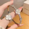 Conjunto de Pulsera y Anillo Flor de la Suerte Flor de Concha Planta, Cobre Electrochapado, Estilo Fresco y Dulce