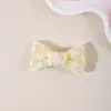 El nuevo accesorio para el cabello transfronterizo de Amazon para niños es un exquisito pasador de lazo para el cabello para niñas, adecuado para flequillos laterales y como adorno para el cabello.